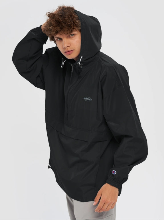Veste coupe-vent noire SIÈCLE × Champion — photo du produit.